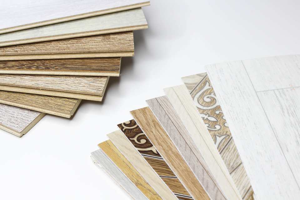 variety of wood look and tile look laminate flooring samples